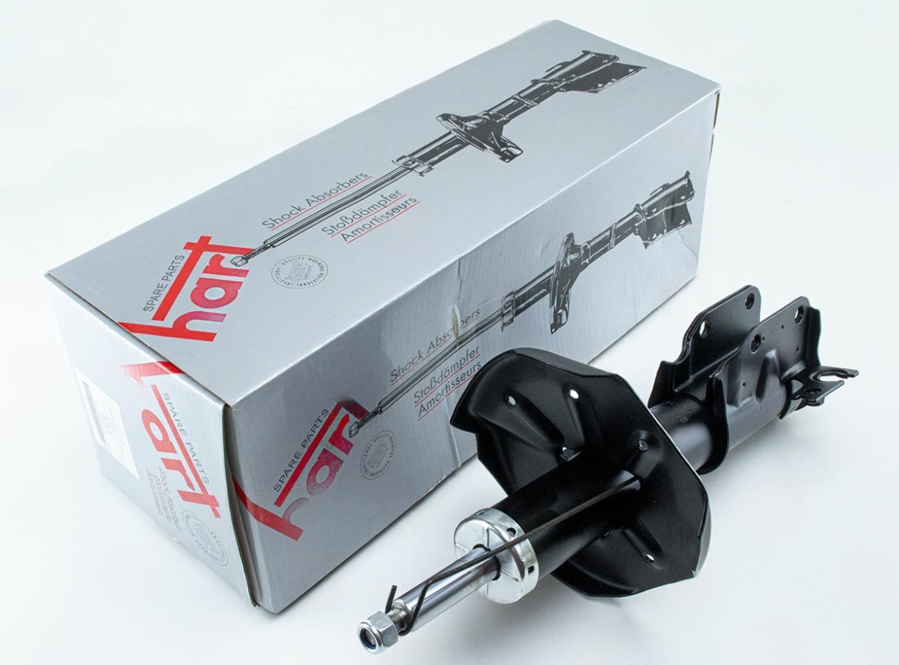 амортизатор пер. Mazda 323 (00-04) левый L  (HART)