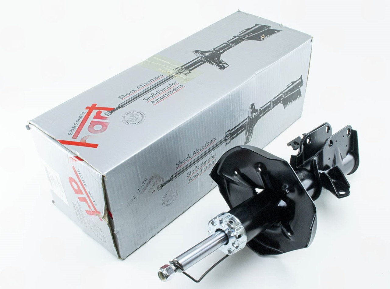 амортизатор пер. Mazda 323 (98-01) левый L  (HART)