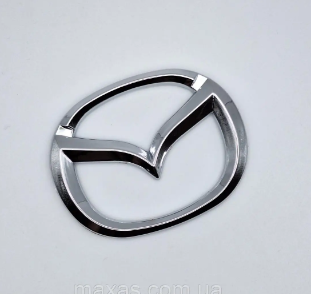 эмблема реш. Mazda 626-323 1992-> новая 63x50мм